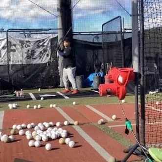 Pitching machine in use